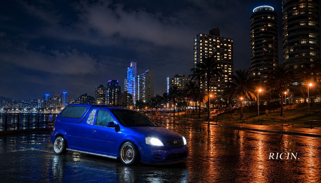 Ricin Xpress blue delivery van driving through Durban at night past the Moses Mabhida Stadium arch